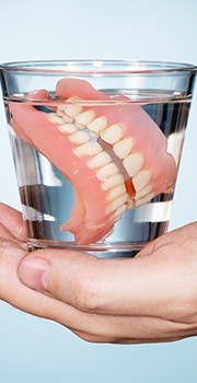 dentures in glass of water